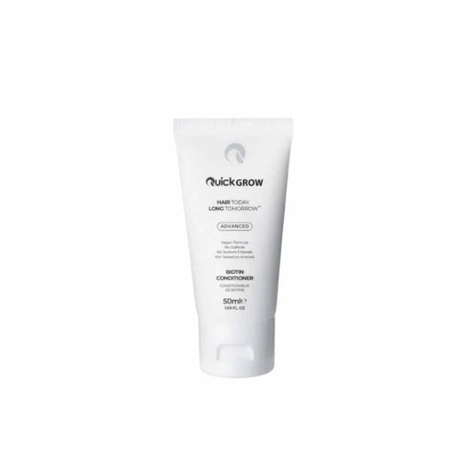 White tube of quickgrow hair treatment on a white background