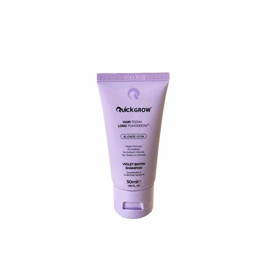 Purple tube of QuickGrow hair care product on a white background